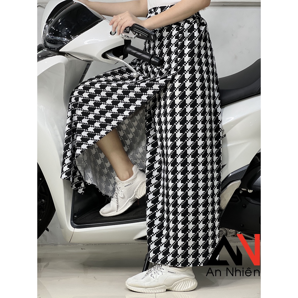 váy chống nắng xẻ tà có túi phía trước cố định bằng miếng dán kết hợp nút bấm - dưới chân váy có nút bấm