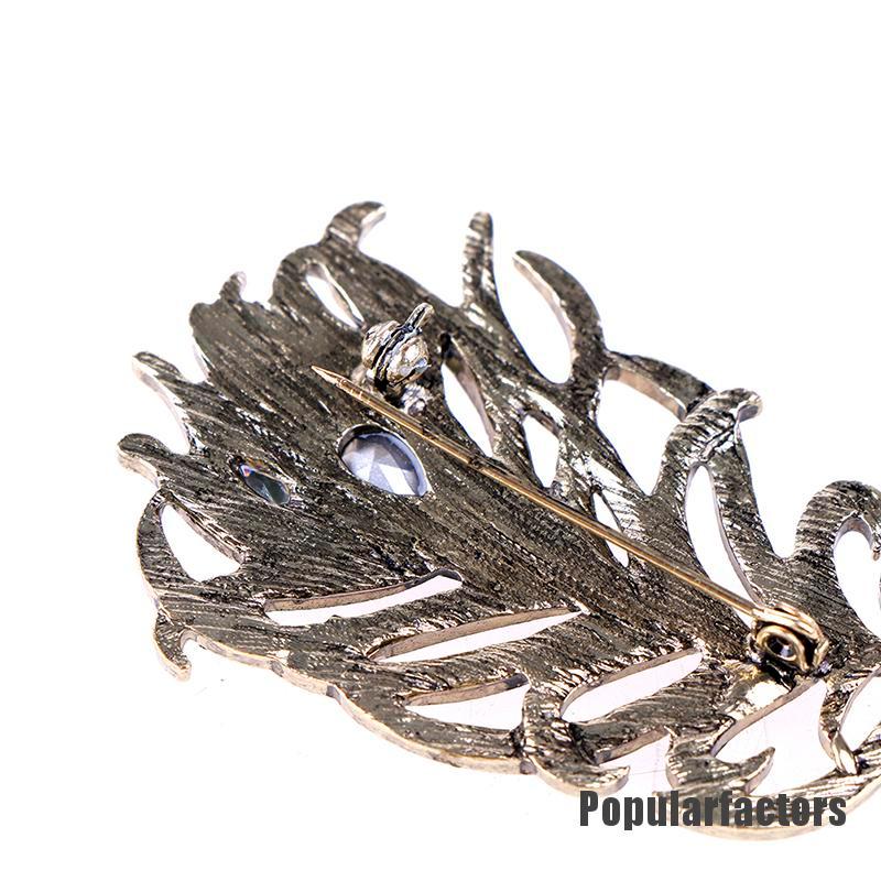 Ghim cài hình lông công đính đá thời trang