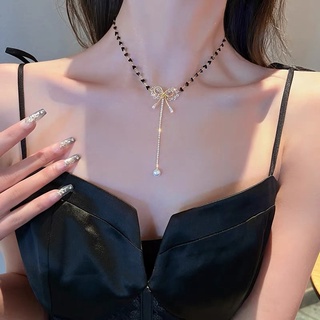 Vòng cổ hạt cườm đen nơ trắng