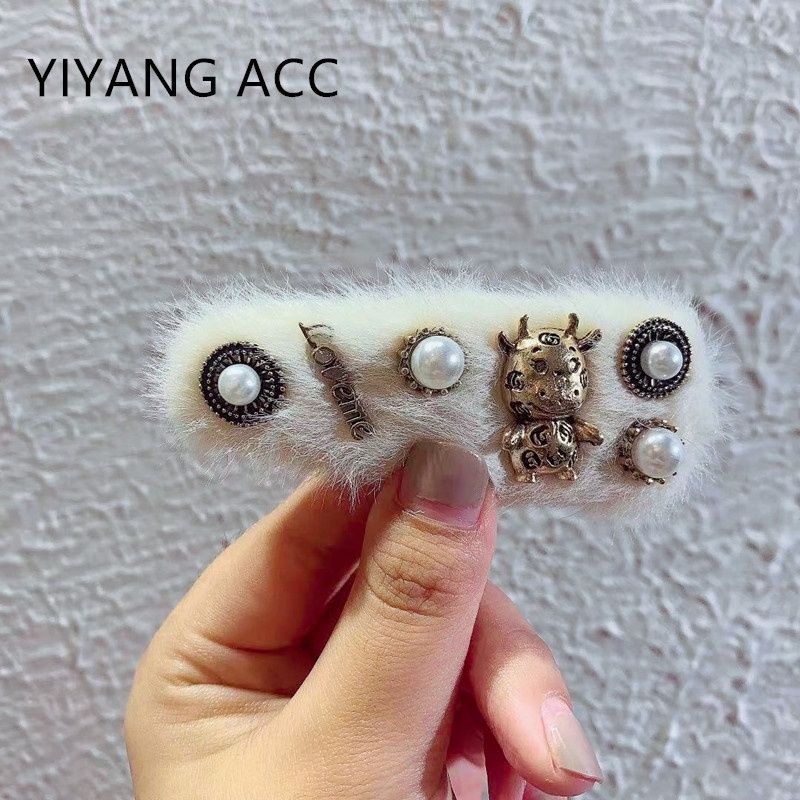 kẹp tóc lông trắng xinh