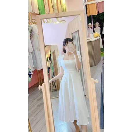 Maxi trắng tay búp cột nơ eo.
