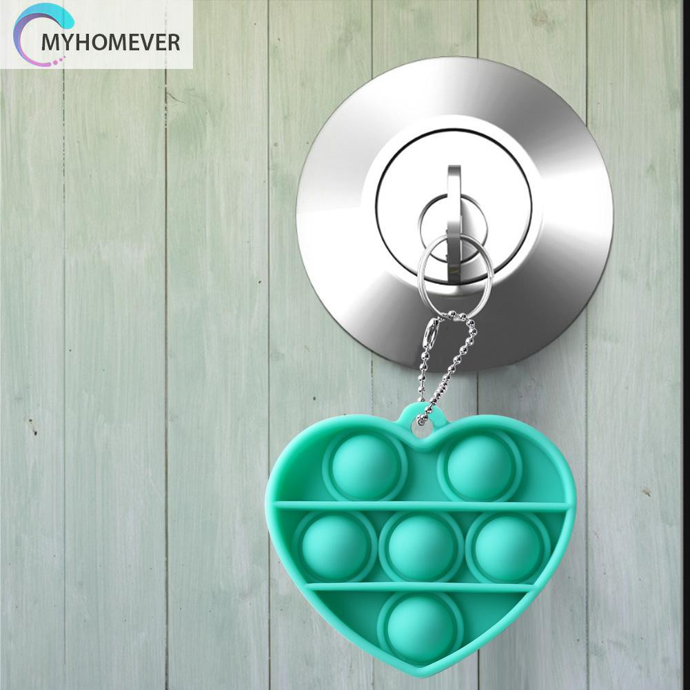 Móc khóa silicon hình trái tim có thể bóp tay đàn hồi bề mặt bật bong bóng