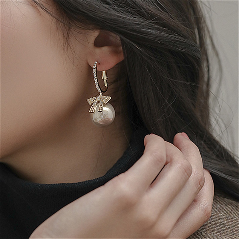 Khuyên tai nơ đính ngọc trai thiết kế mới 2021