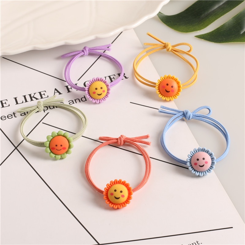 Dây buộc tóc hoa mặt cười xinh xắn  Clovershop68