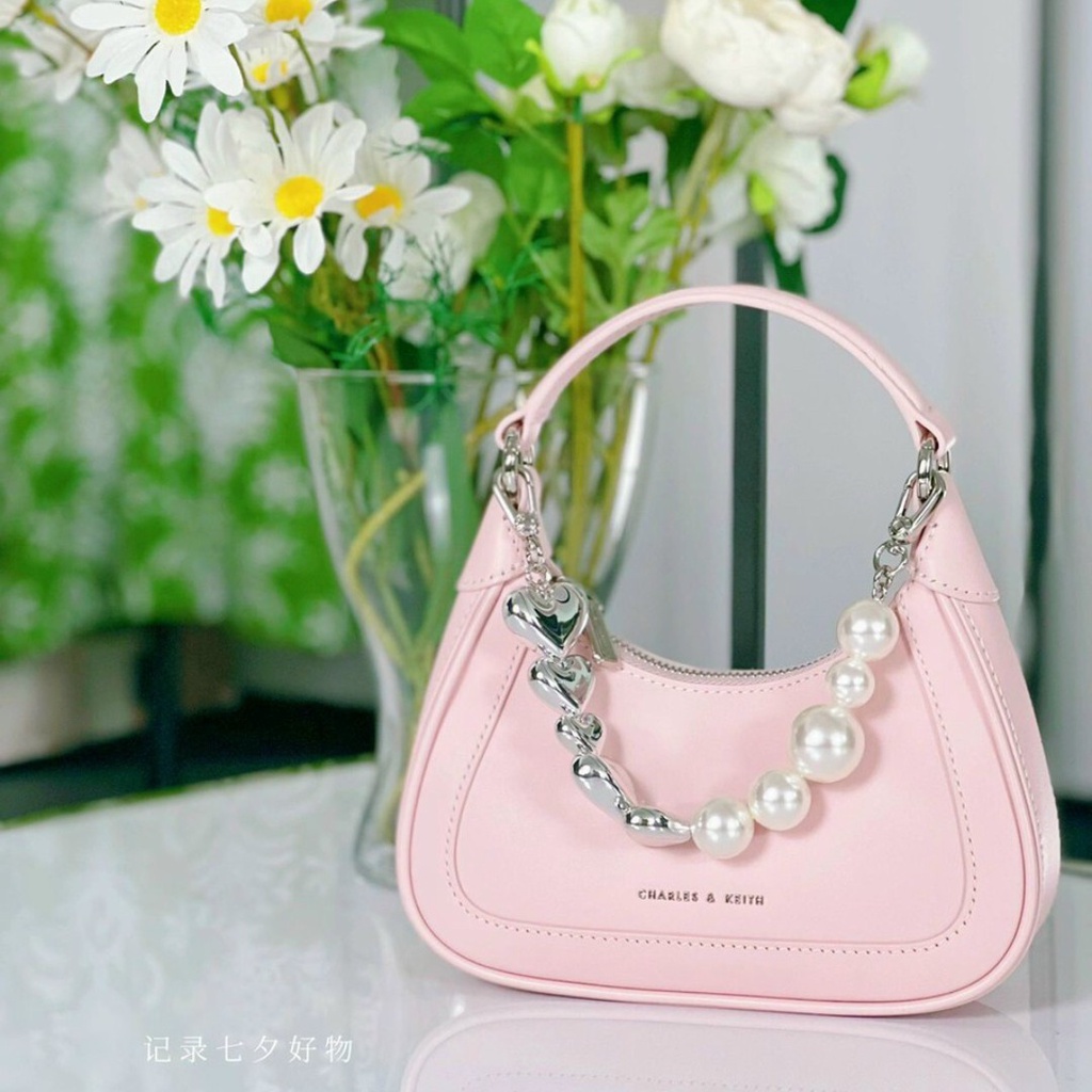 Túi cầm tay CnK màu hồng phối dây đeo hình trái tim và ngọc trai nhân tạo fullbox làm quà