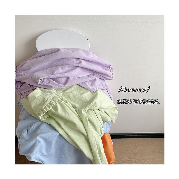 Áo sơ mi nữ dài tay cổ búp bê màu vàng kem phong cách cổ điển thời trang xuân