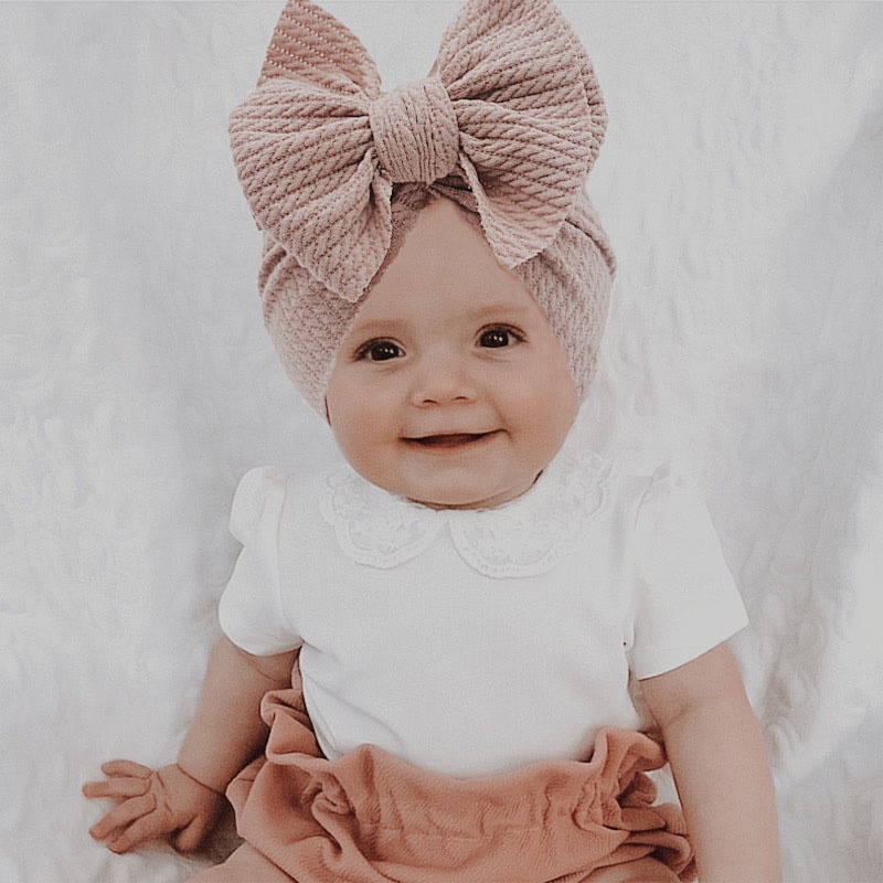 Mũ beanie mềm co giãn màu trơn đính nơ thời trang thu đông cho bé tùy chọn màu sắc