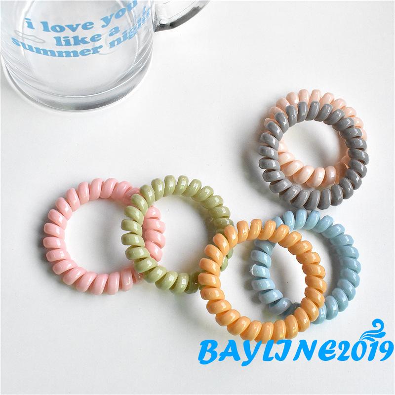 Dây buộc tóc co giãn màu trơn xoắn ốc không để lại dấu vết cho nữ