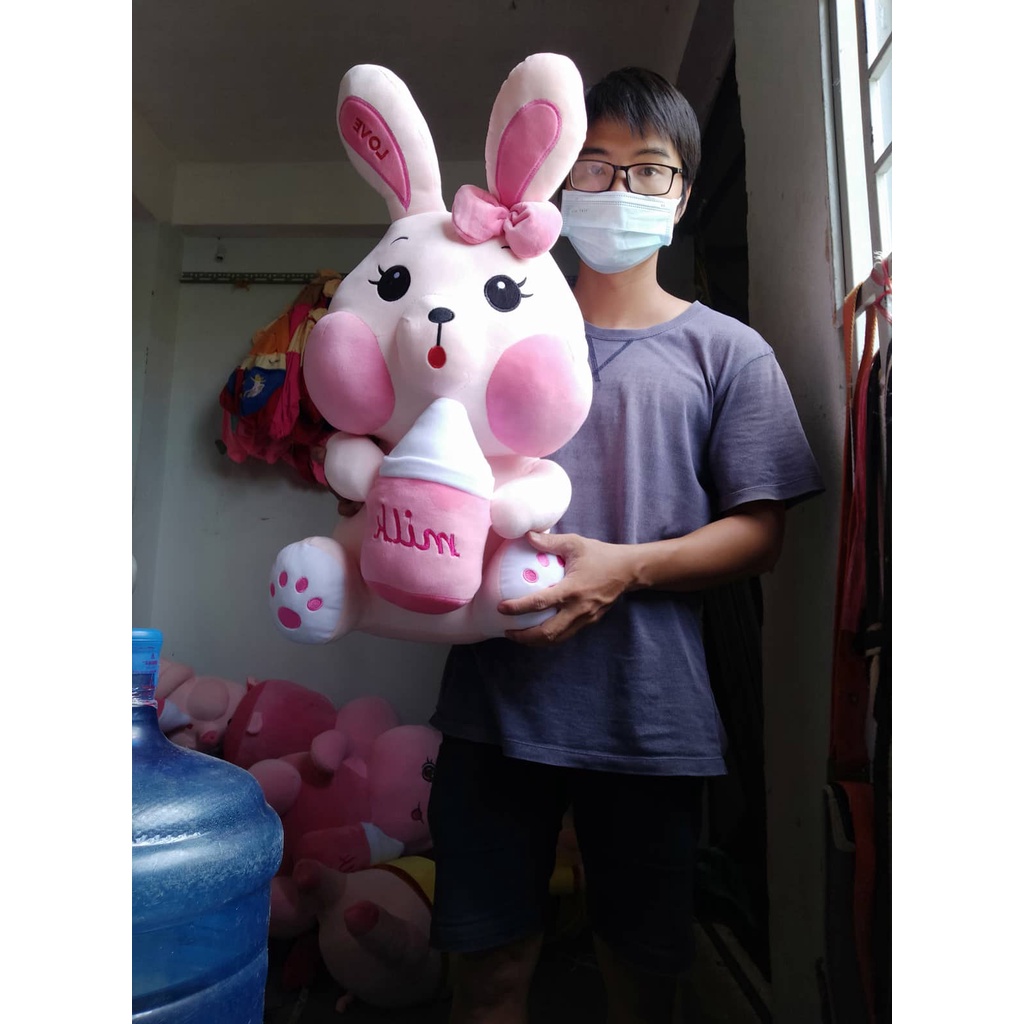 Gấu bông thỏ bông Thỏ ôm bình sữa , thỏ ôm kẹo