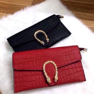 Ví cầm tay đầu rồng