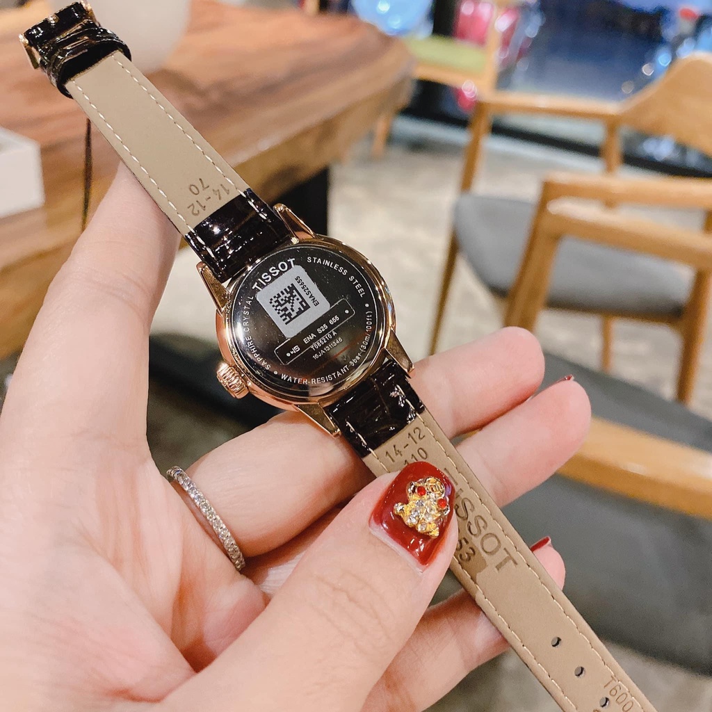 Đồng hồ Tissot nữ mặt tròn, dây da đen, viền vàng hồng T0852103601300