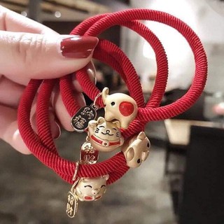 Buộc tóc kiêm vòng tay dây đỏ