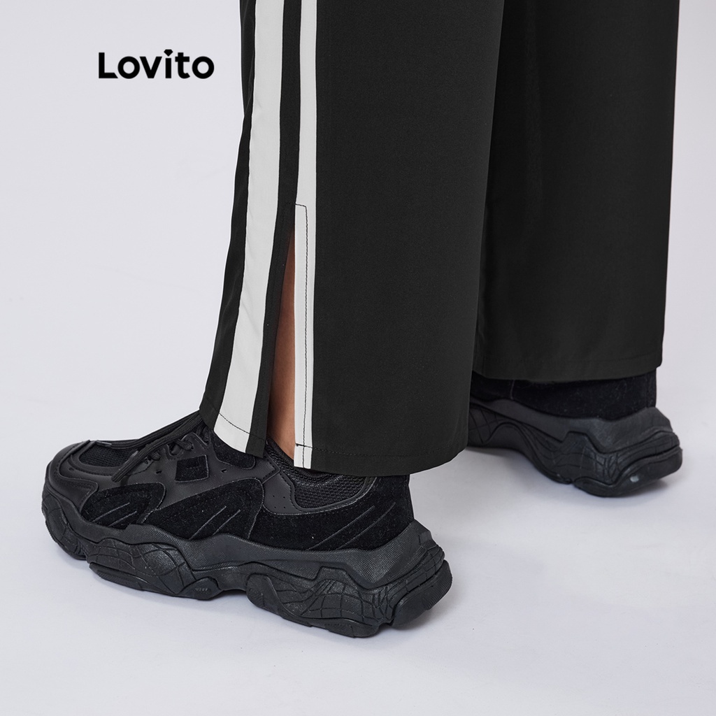 Quần Lovito màu trơn xẻ gấu phối viền tương phản phong cách thể thao L26AD073 (màu đen)