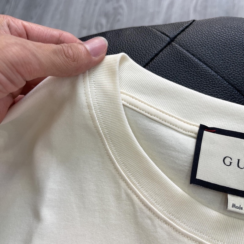 Áo Tee Gu*cci 100 Music Is Mine Màu Off-White