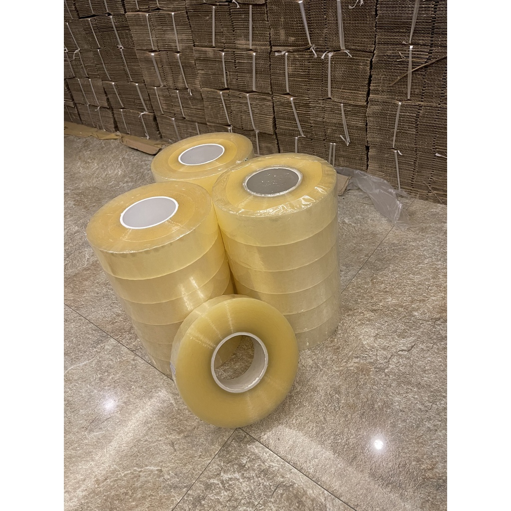 Băng dính màu trắng trong 1kg dùng gói hàng COD lõi siêu mỏng - 1 cuộn