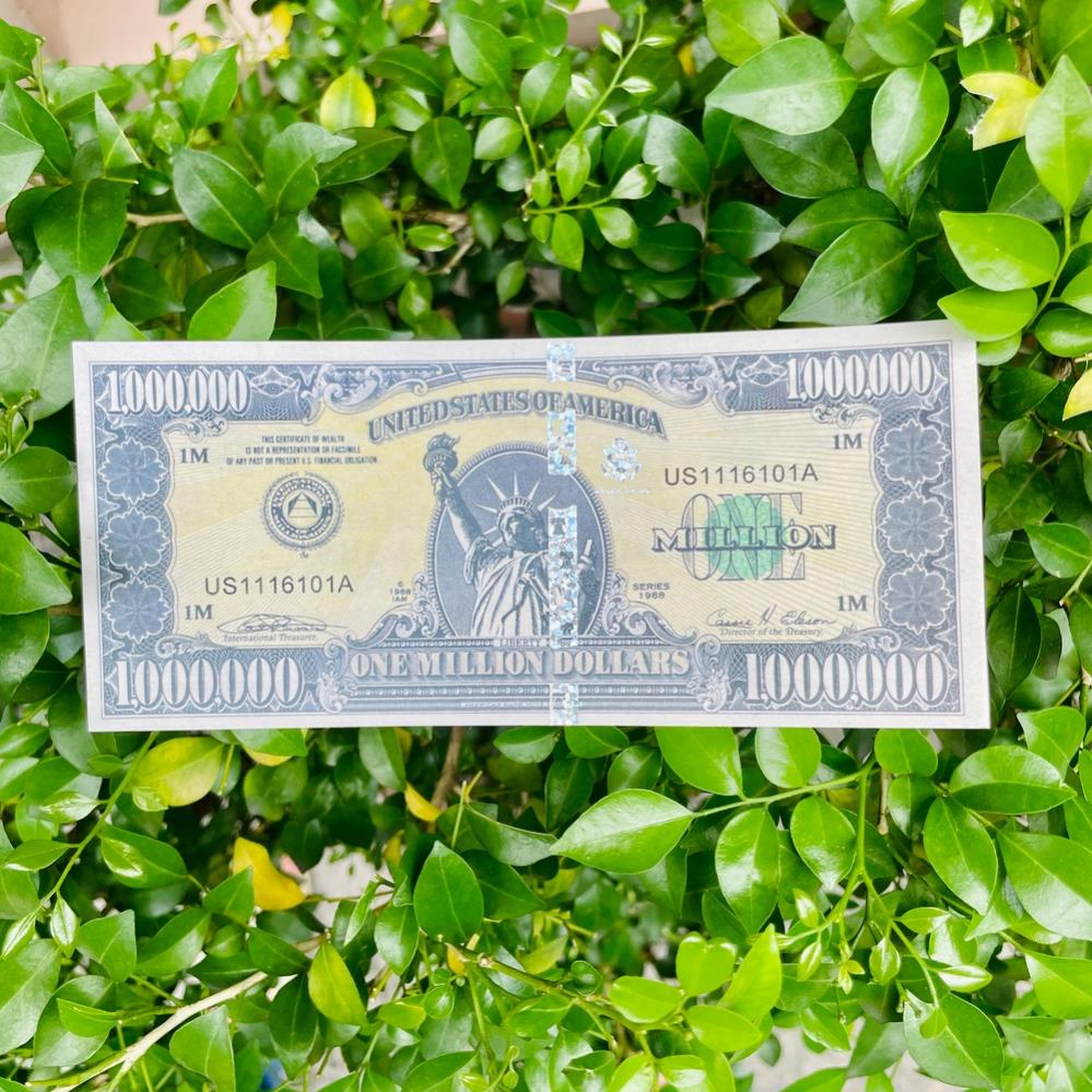 Tiền lưu niệm 1 triệu USD dạ quang; có dây bảo an biến đổi phát quang
