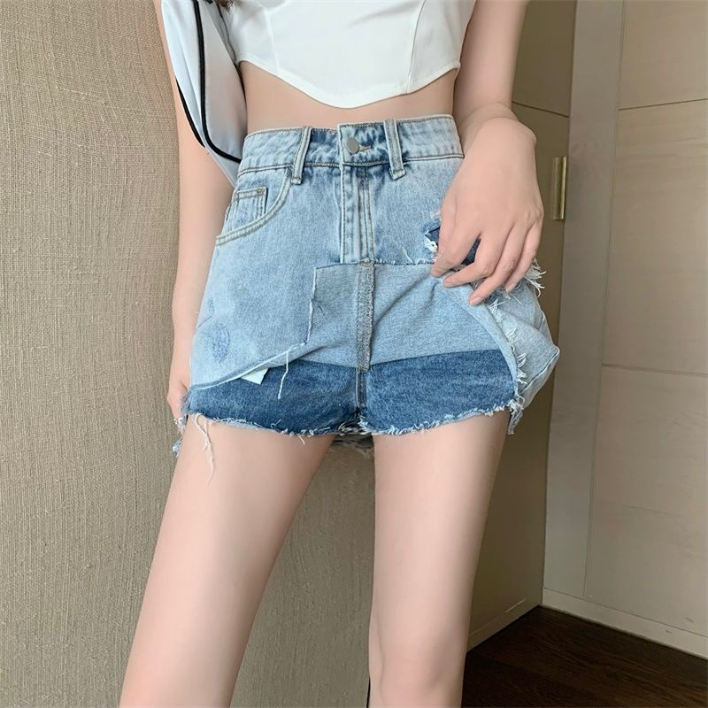 Chân váy denim siêu ngắn ngang hông cạp cao phối lỗ không đồng đều phong cách mùa hè 2022 cho nữ