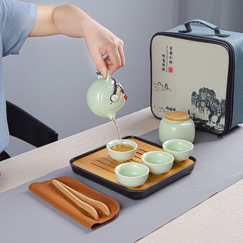 Bộ ấm chén pha trà  du lịch bằng sứ cao cấp bộ tách pha trà tử sa có túi xách kèm khay trà và gắp chén tre khăn lau
