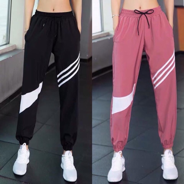 Quần jogger dù sọc đùi thể thao