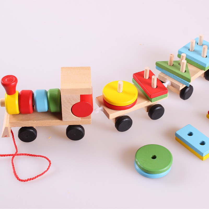 Đồ chơi montessori tàu hỏa nhiều màu sắc chở khối gỗ thả hình trụ cho bé