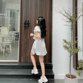 Đầm trắng nơ ngực to