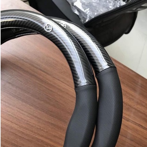 Bọc vô lăng CARBON phối da thoáng khí đủ các hãng xe Toyota-Honda-Hyundai-Mazda-KiA-Ford-Mitshubishi-Chevrolet cao cấp