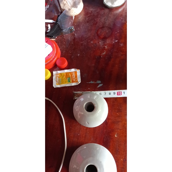 Xứ treo cách điện,sứ quấn dây điện dân dụng