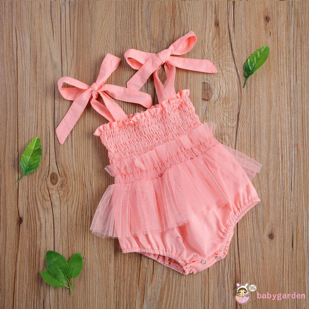 Áo liền quần đính nơ hợp thời trang cho bé gái