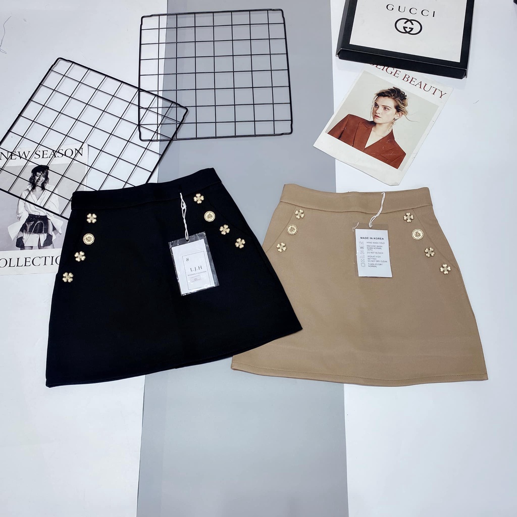 Chân váy chữ A đính cúc hoa