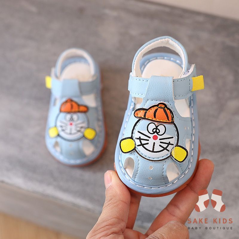 Sandal tập đi bé trai bé gái - Dép rọ có còi hình Đoremon dễ thương chống trơn trượt cho bé từ 0-1 tuổi M301