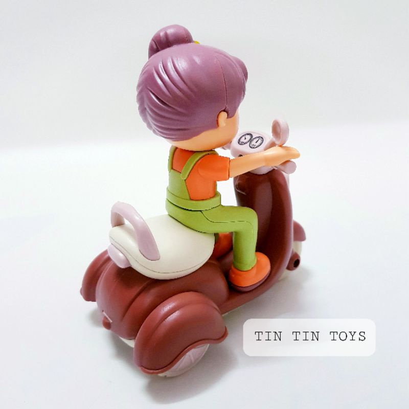 Đồ chơi cô bé chạy xe máy siêu dễ thương