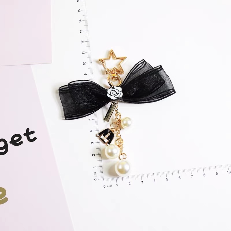 Charm treo túi/ví gắn nơ