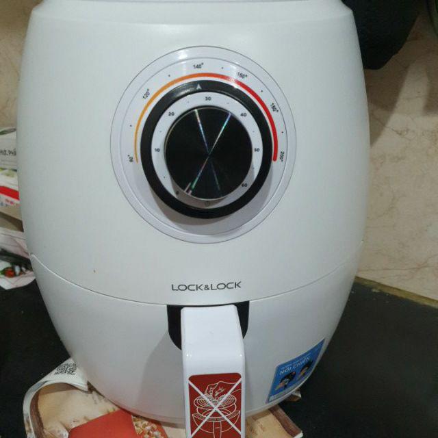 An aerial view of waves crashing against a shore.