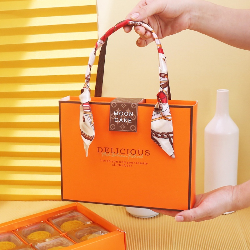 Hộp đựng bánh trung thu màu cam hình túi xách MOON CAKE DELICIOUS xinh xắn