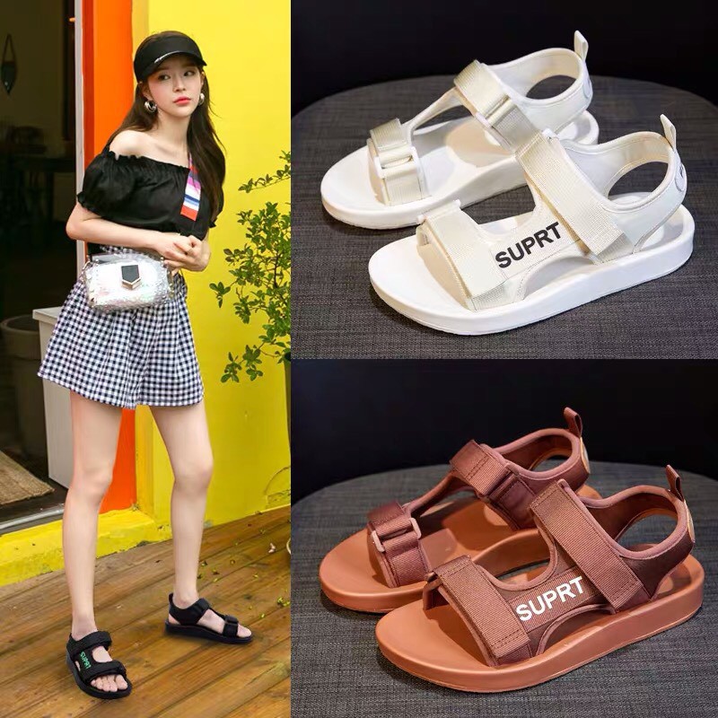 Sandal nữ SUPRT có 3 màu đen, trắng & nâu, thiết kế quai ngang đế bằng, phong cách hàn quốc, đi học, đi chơi đều được