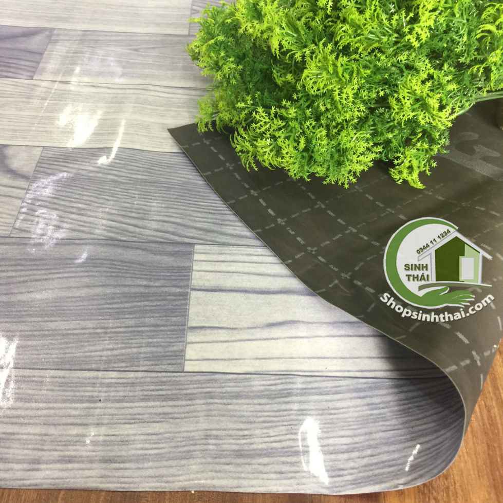 Thảm nhựa PVC simili trải sàn vân gỗ màu xám bóng