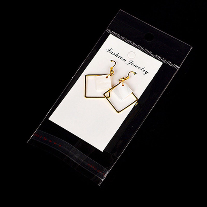 Set 100 túi tự dính và thẻ giấy màu trắng đựng trưng bày trang sức