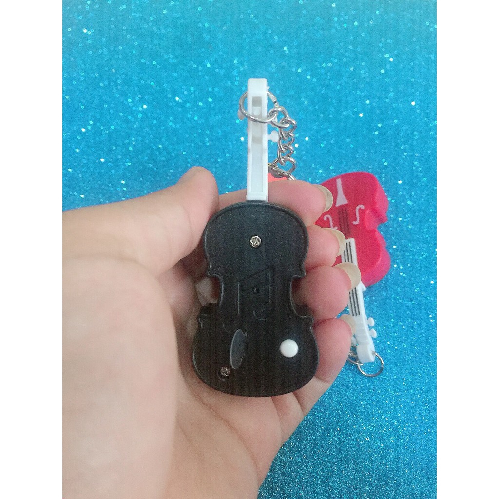 Móc khóa đàn Ghita phát sáng đèn Led,có âm thanh độc đáo.Móc chìa khóa hình đàn ghita với đèn LED phát sáng dễ thương