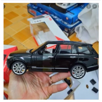 Xe mô hình ô tô Range Rover tỉ lệ 1:32 xe ô tô bằng sắt có vô lăng bẻ lái mở cửa trước đồ chơi trẻ em