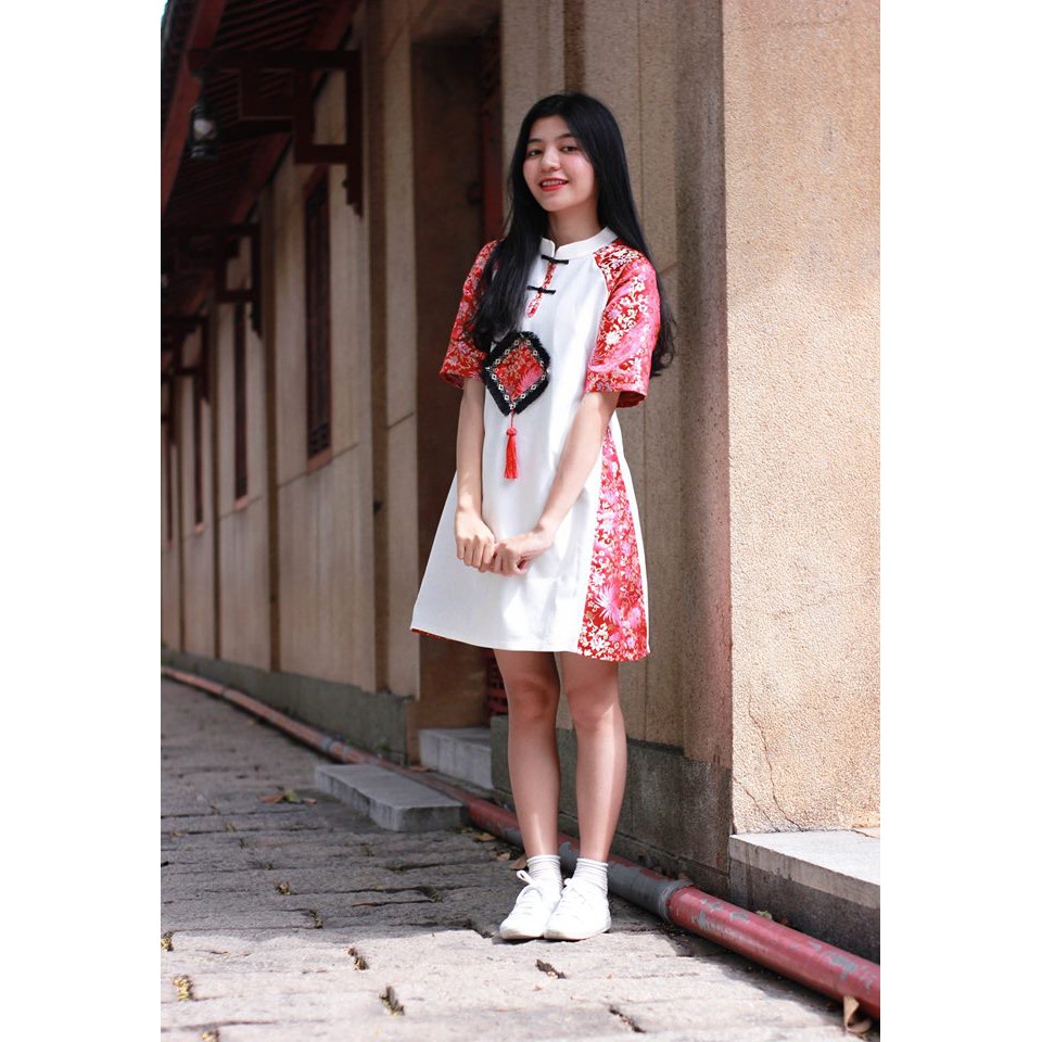 Đầm gấm tay phối