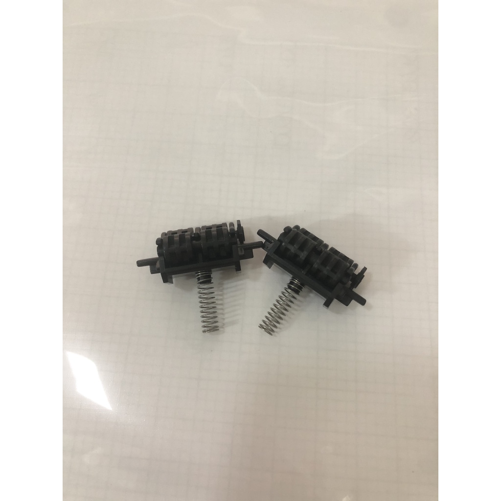 Bộ 2 con lăn ra giấy máy in Canon 3300 HP 2015d 2015dn 1320