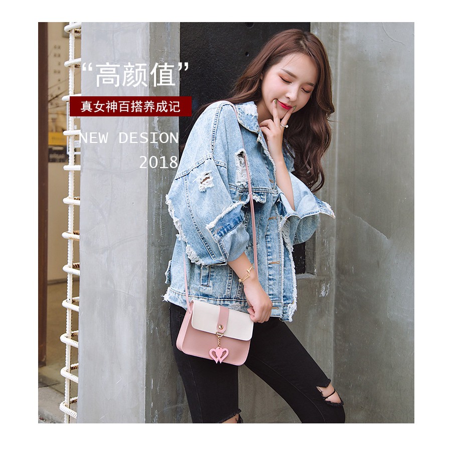 Túi đeo chéo da mềm đính núm tua nữ tính