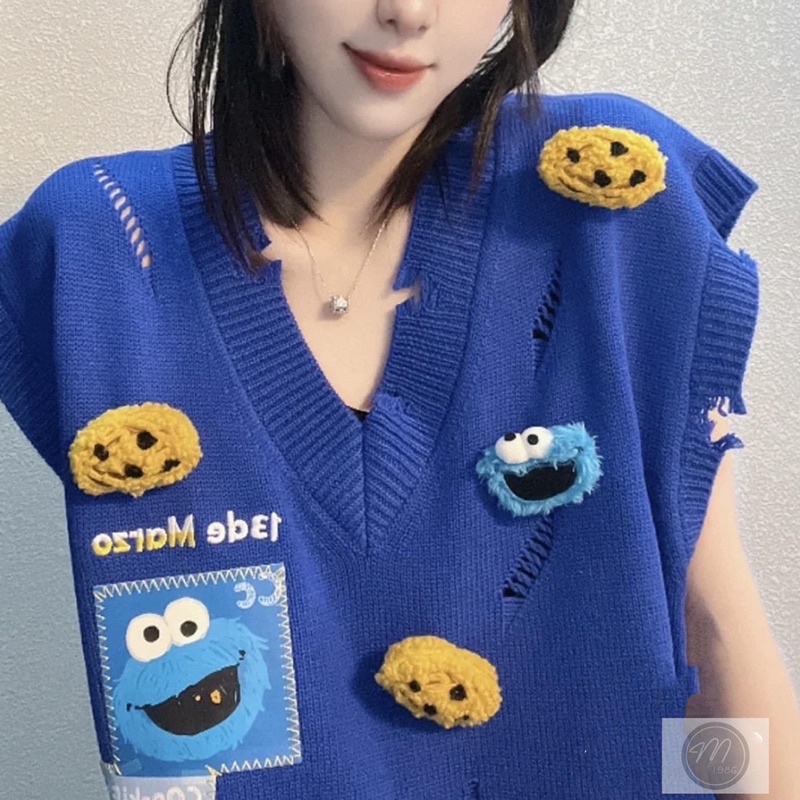 Áo gile len 13de marzo lưng đính gấu bông