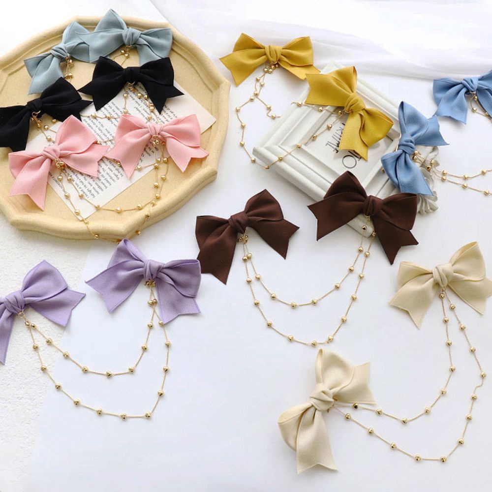 Kẹp tóc nơ đôi phối tua rua màu trơn phong cách Hàn Quốc dễ thương cho nữ