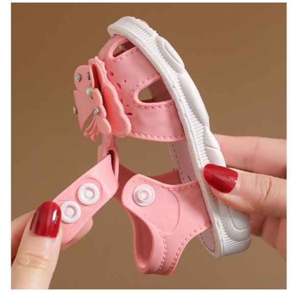 GIÀY SANDAL TẬP ĐI HÌNH NƠ VÀ HOA CÚC BẤM CHO BÉ