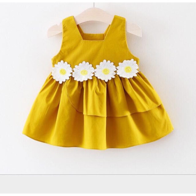 Váy hoa cúc vàng cho bé gái