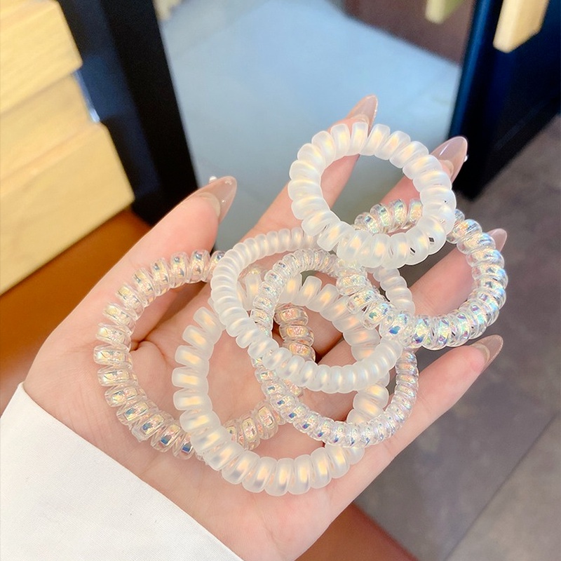 Dây buộc tóc lò xo hologram, chun buộc tóc lò xo nhựa xoắn