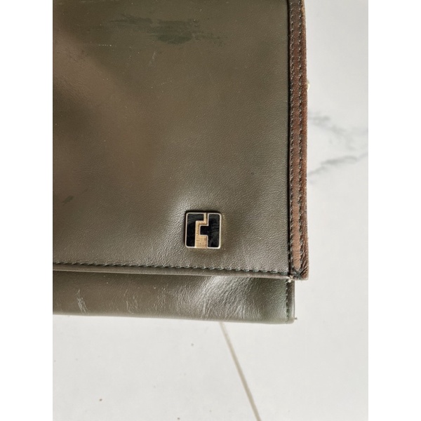 Ví cầm tay si của Pháp da mộc Ted Lapidus Paris