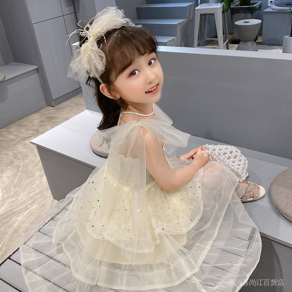 Đầm Công Chúa Hai Dây Phồng Đính Kim Sa Ngôi Sao Năm Cánh Màu Be Thời Trang Mùa Hè Cho Bé Gái