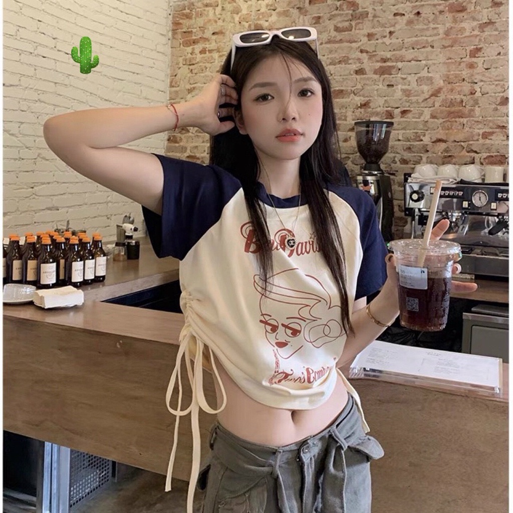 Áo kiểu croptop màu kem tay xanh in chữ logo trước rút dây 2 bên cực xinh , chất thun bozip mềm mịn